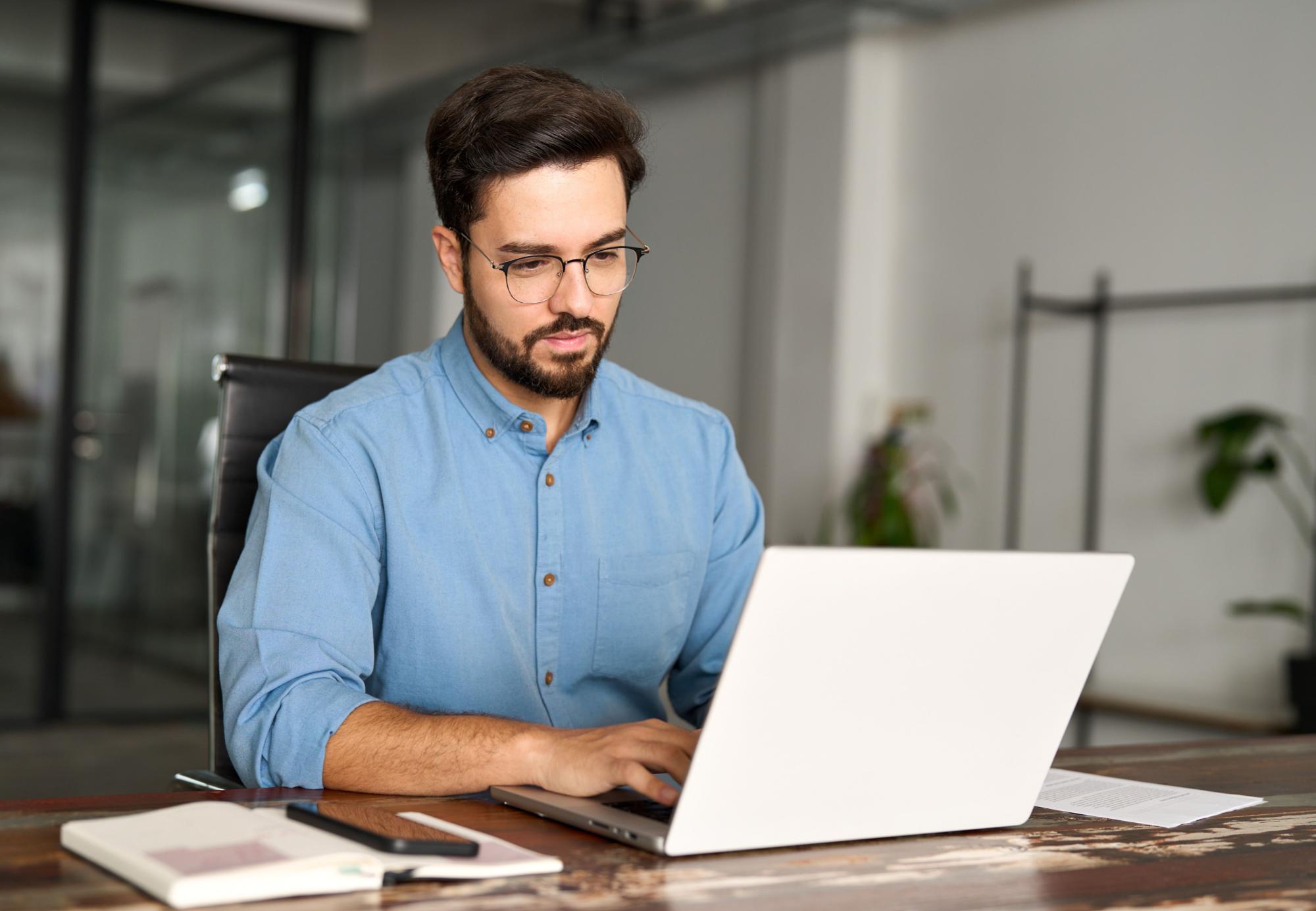 Professional man typing on computer