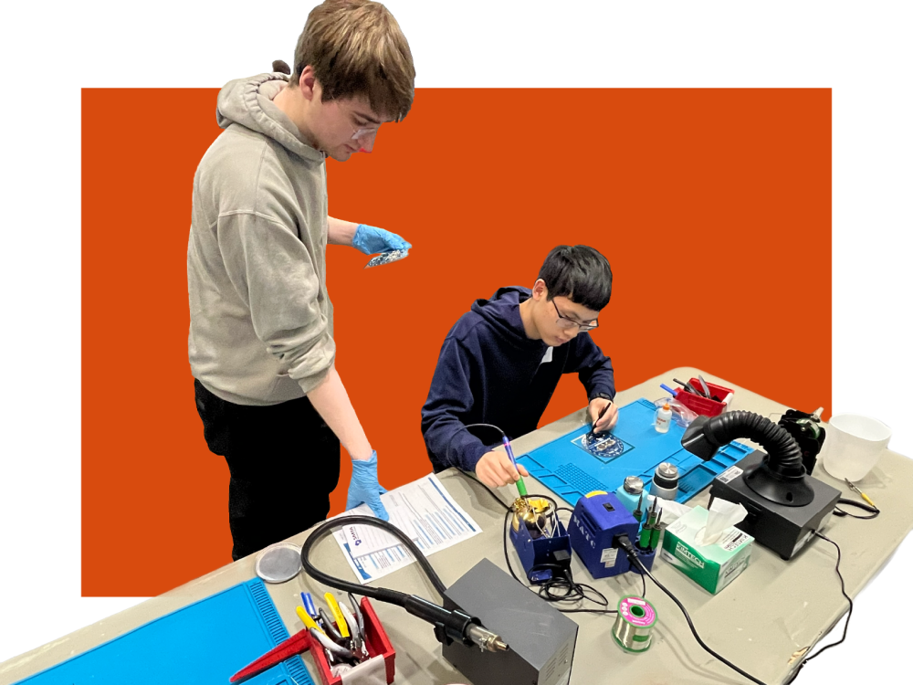 Students working on printed circuit board